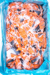 Slices of salmon frozen on ice