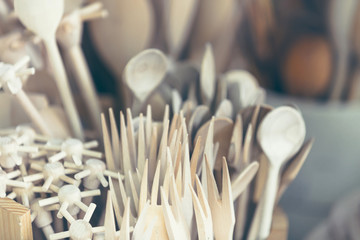 Pile of wooden kitchen utensils with shallow depth of field.