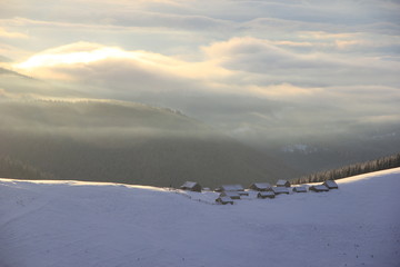 a group of houses on the top of a snow-covered mountain, carpathians