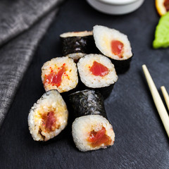 Japanese sushi rolls maki on the graphite board
