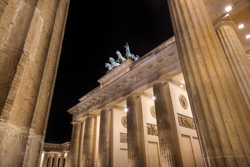 Germany, Berlin, Pariser Platz: Detail of illuminated Brandenburg Gate (Brandenburger Tor) at night in the middle of the German capital. The monument was built by king Frederick William II.