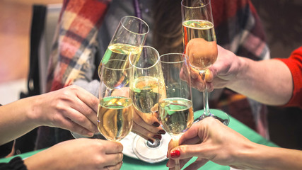 Clinking glasses with white wine