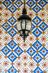 Old colonial lamp on colorful background.