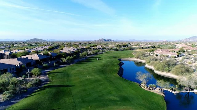 Aerial Scottsdale AZ Golfer Chips Onto Green