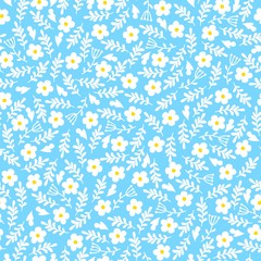 Seamless background of small daisies leaves on a blue background. Pattern for fabric, wrapping paper and scrapbooking