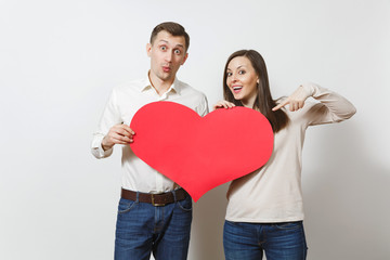 Couple in love. Man and woman with big red heart isolated on white background. Copy space for advertisement. With place for text. St. Valentine's Day International Women's Day birthday holiday concept