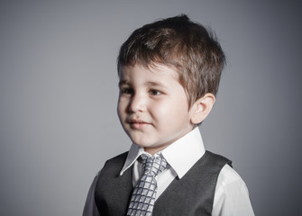 delusion, little businessman, brown-haired boy dressed in suit and tie with faces and funny expressions