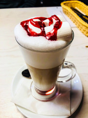 Latte with marshmallow and raspberry topping