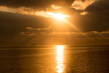 A golden sunrise in the sea of Ibiza