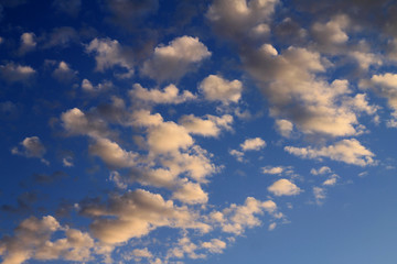 Small white clouds on blue sky