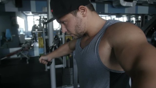 Man is getting big doing cable crossover fly