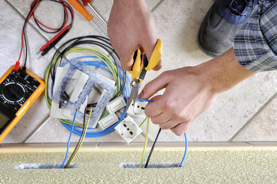 Electrician technician at work on a residential electric system