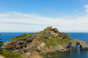 Fototapeta na wymiar Magnificent views of San Juan de Gaztelugatxe, small peninsula by Cantabric Sea on sunny day in The Basque Country, Spain