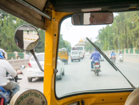 View from inside of a auto rickshaw in India. also known as tuk tuk.