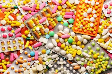 Fototapeta na wymiar Medicine pills and colorful blisters pack