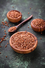 Buckwheat groats in wooden bowl