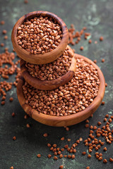 Buckwheat groats in wooden bowl