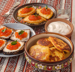 Red caviar and thick potato pancakes at Shrovetide (mass produced products)