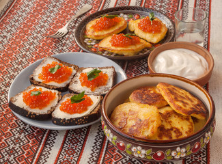 Red caviar and thick potato pancakes at Shrovetide (mass produced products)