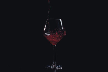 pouring a glass of red wine