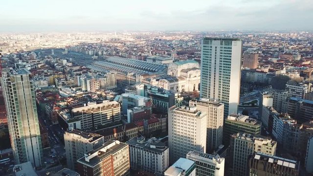 Milan aerial view, drone 4k shot over Milan Central Station on sunset