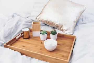 Obraz na płótnie Canvas Coffee cup on tray. Styled morning at home