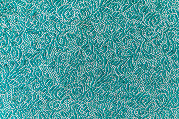 vintage patterns on green fabric