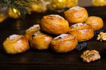 homemade cookies with sugar, New Year decorations, on a dark wooden background with a spruce branch