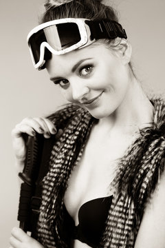 Black and white picture with girl and goggle.