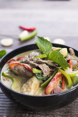 Thai Green Curry with Beef in a black bowl