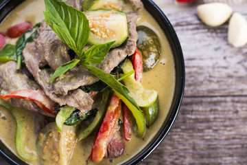 Thai Green Curry with Beef in a black bowl