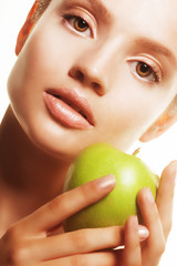 Young  woman with green apple, isolated on white background