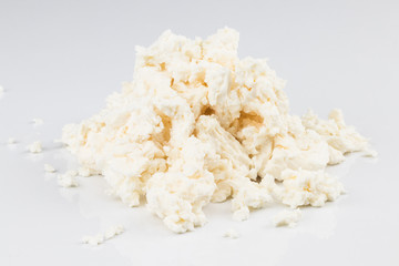 Cottage cheese (curd) heap, isolated on white