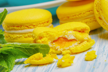 Obraz na płótnie Canvas Yellow macarons. French delicate dessert for Breakfast in the morning light