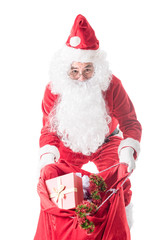 Santa Claus carrying big bag  to delivery christmas gifts isolated on white background