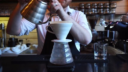 Barista doing second pour over V60 alternative coffee brew style