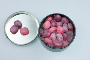 red lollipops white background selective focus closeup