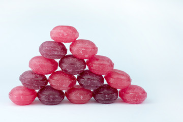 red lollipops white background selective focus closeup