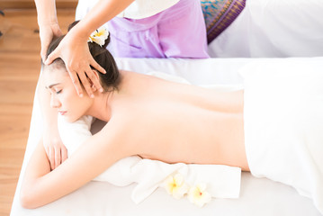 Obraz na płótnie Canvas Young healthy asian woman lying relax in spa salon.Traditional Thai oriental aromatherapy and Massage beauty treatments.Recreation vitality wellness wellbeing resort hotel lifestyle leisure,top view