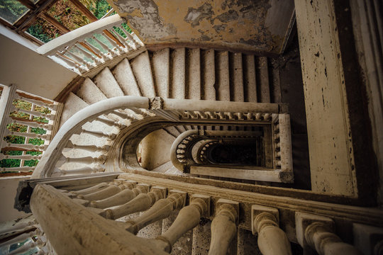 Top view of old vintage decorated staircase in abandoned mansion