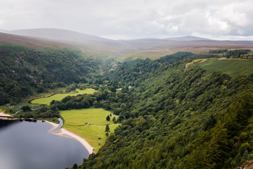 Lough Tay, Lake in Wiclow Mountains, foggy rainy weather cloudy, bank shoreline