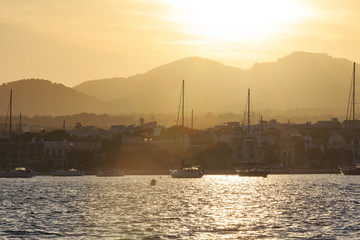Europe, Spain, Balearic Islands, Mallorca. Porto Colom. Sailboats at sunset.