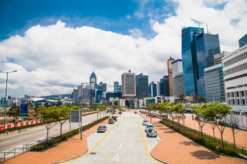 Inner city street with modern skyscrapers . Hong Kong