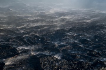 Aerial view of steaming lava field