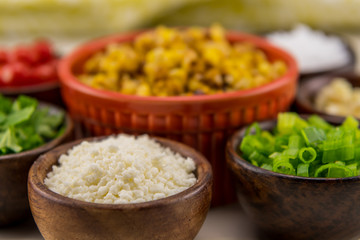 Crumbled Cotija Cheese in Wooden Bowl