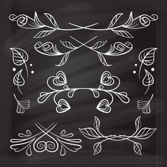 Hand drawn floral elements set on the chalkboard.