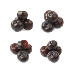Pile of black plums isolated