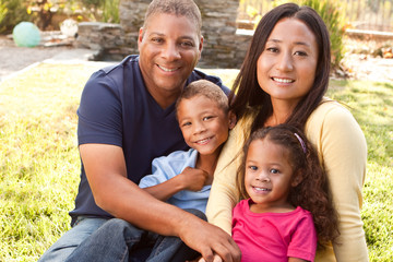 Mixed race mother and her children.