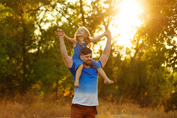 Obraz premium Family. Father and daughter. Piggyback