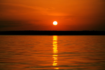 orange sunset over water and sun track background image